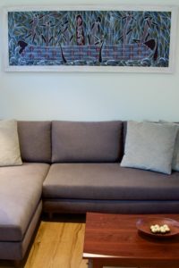 An Aboriginal art piece above the lounge.