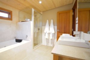 The bath, show and basin of the Mira villa. All tiled with white Italian marble.