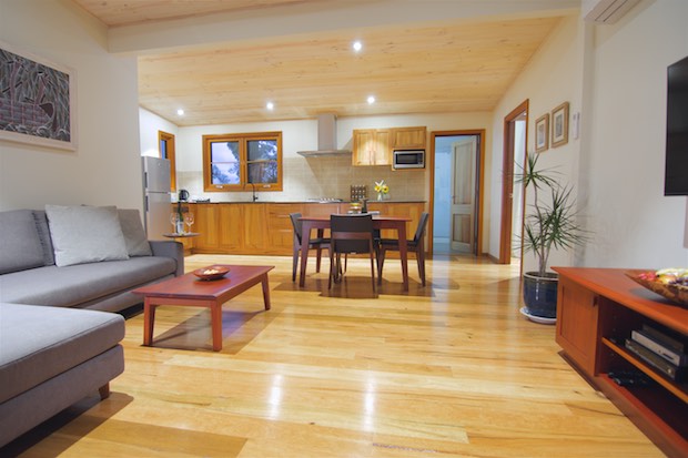 Beautiful wooden floors and welcoming sofa of Mira villa.